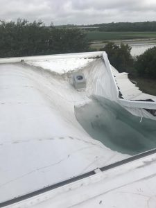 collapsed commercial roofing system